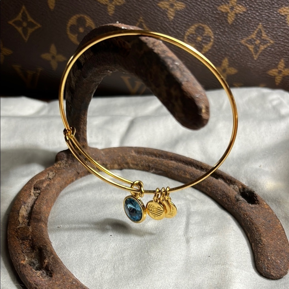 Alex and Ani Gold Bracelet with Blue Charm